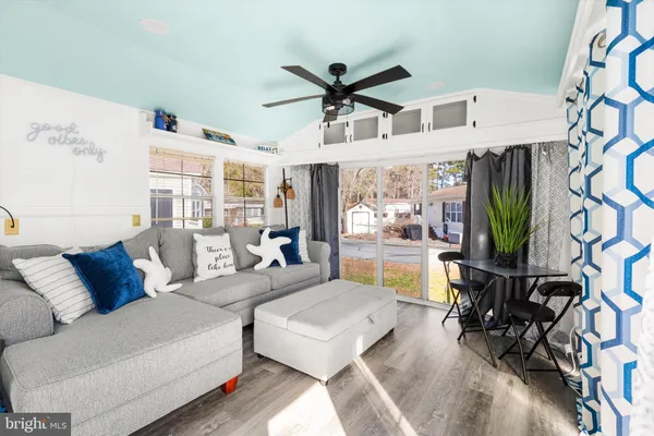 a view of a livingroom with furniture and window