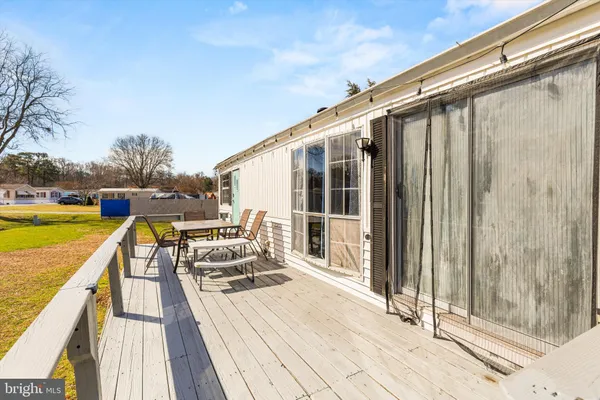 a view of wooden house with a small space
