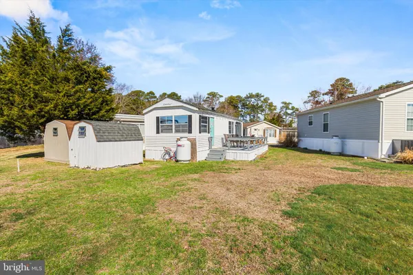a bedroom with a large bed and a dresser