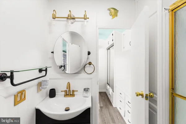 a kitchen with stainless steel appliances a stove sink and refrigerator