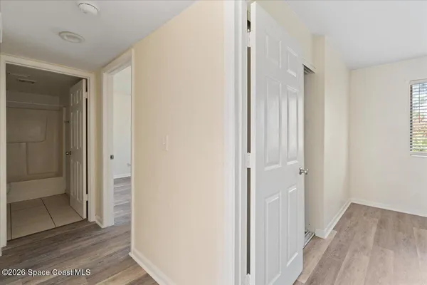 a view of a bathroom with wooden floor