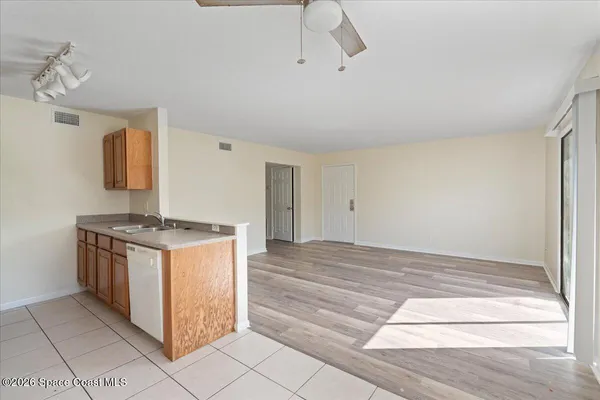 a kitchen with stainless steel appliances granite countertop a stove and a refrigerator
