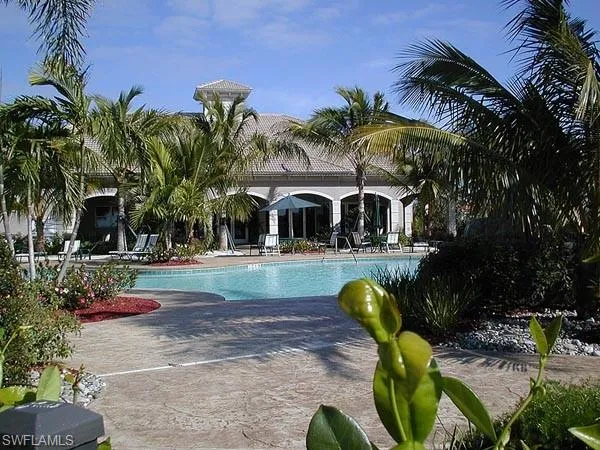 a kitchen with a table chairs sink and microwave