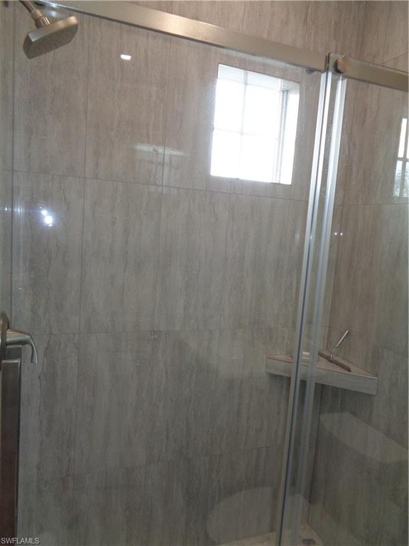709 Regency Reserve Circle, Unit 6003 Naples, FL 34119 - Photo 32 of 44 Bathroom featuring a shower stall