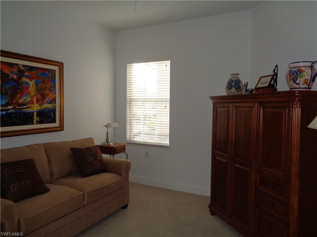 709 Regency Reserve Circle, Unit 6003 Naples, FL 34119 - Photo 33 of 44 a living room with furniture and a window