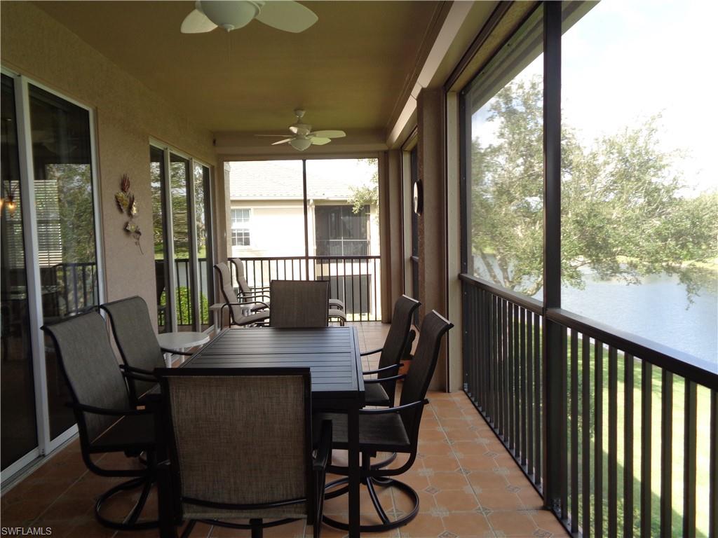 709 Regency Reserve Circle, Unit 6003 Naples, FL 34119 - Photo 36 of 44 a view of a dining room with furniture window and outside view