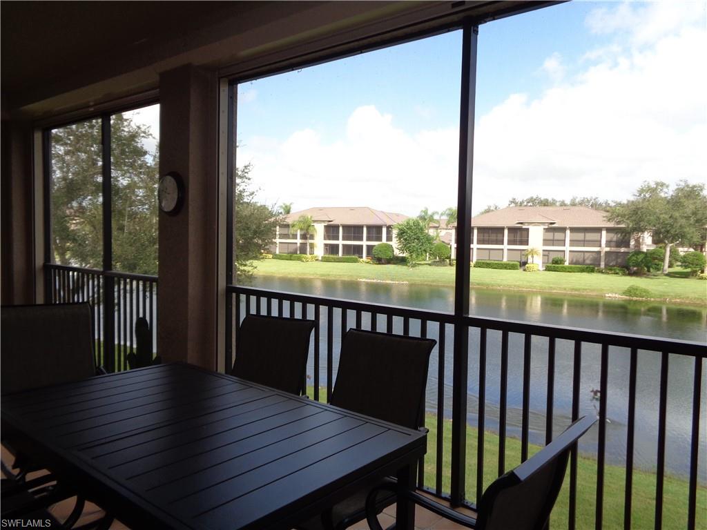 709 Regency Reserve Circle, Unit 6003 Naples, FL 34119 - Photo 42 of 44 Sunroom featuring a water view