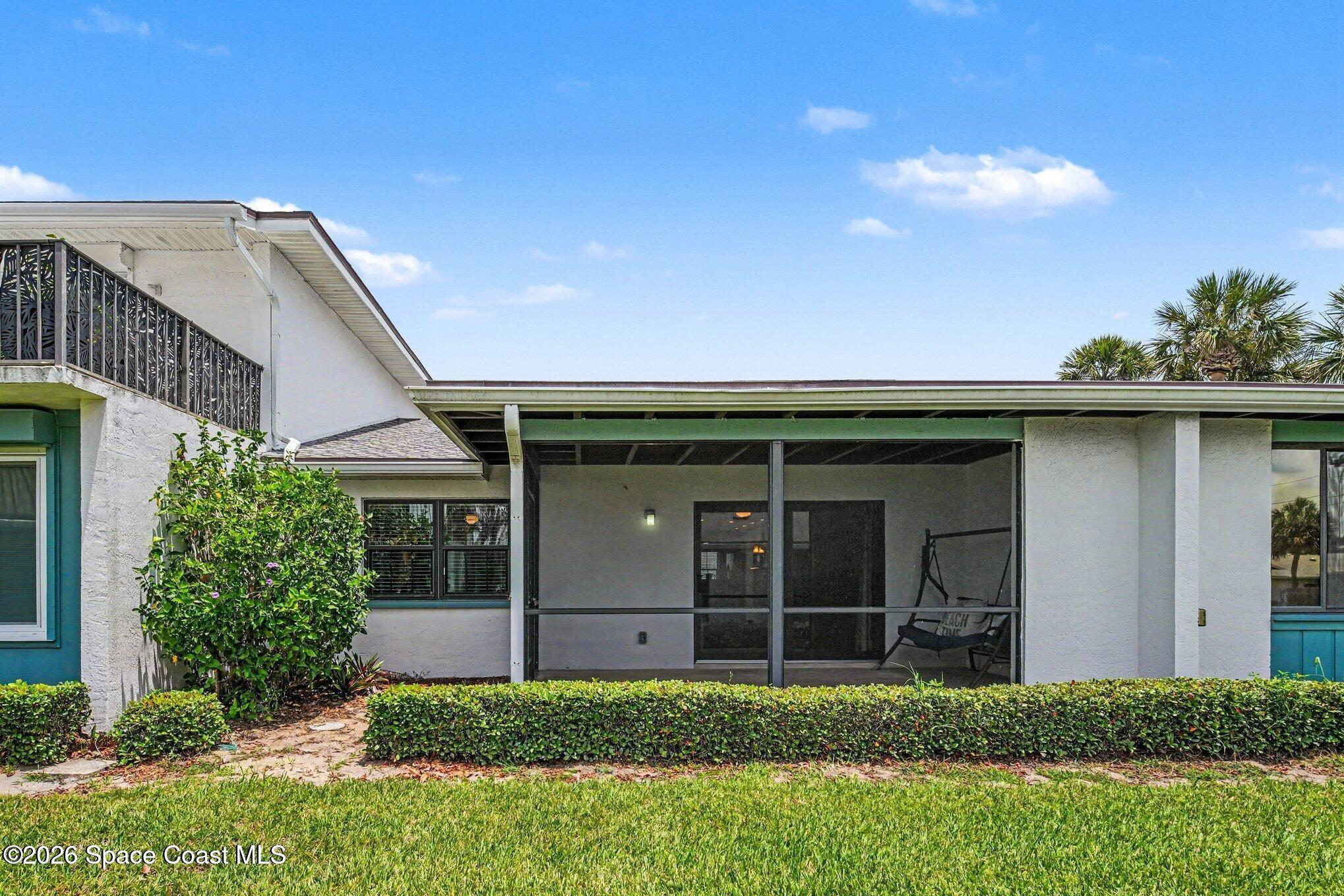290 Paradise Boulevard, Unit 2 Indialantic, FL 32903 - Photo 16 of 20 Screened patio