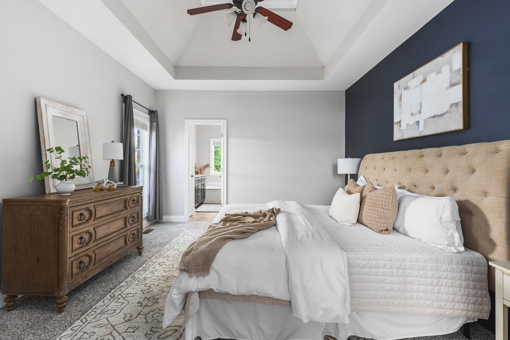 852 Bradshaw Road Lebanon, TN 37087 - Photo 17 of 41 a bedroom with a bed and a chandelier