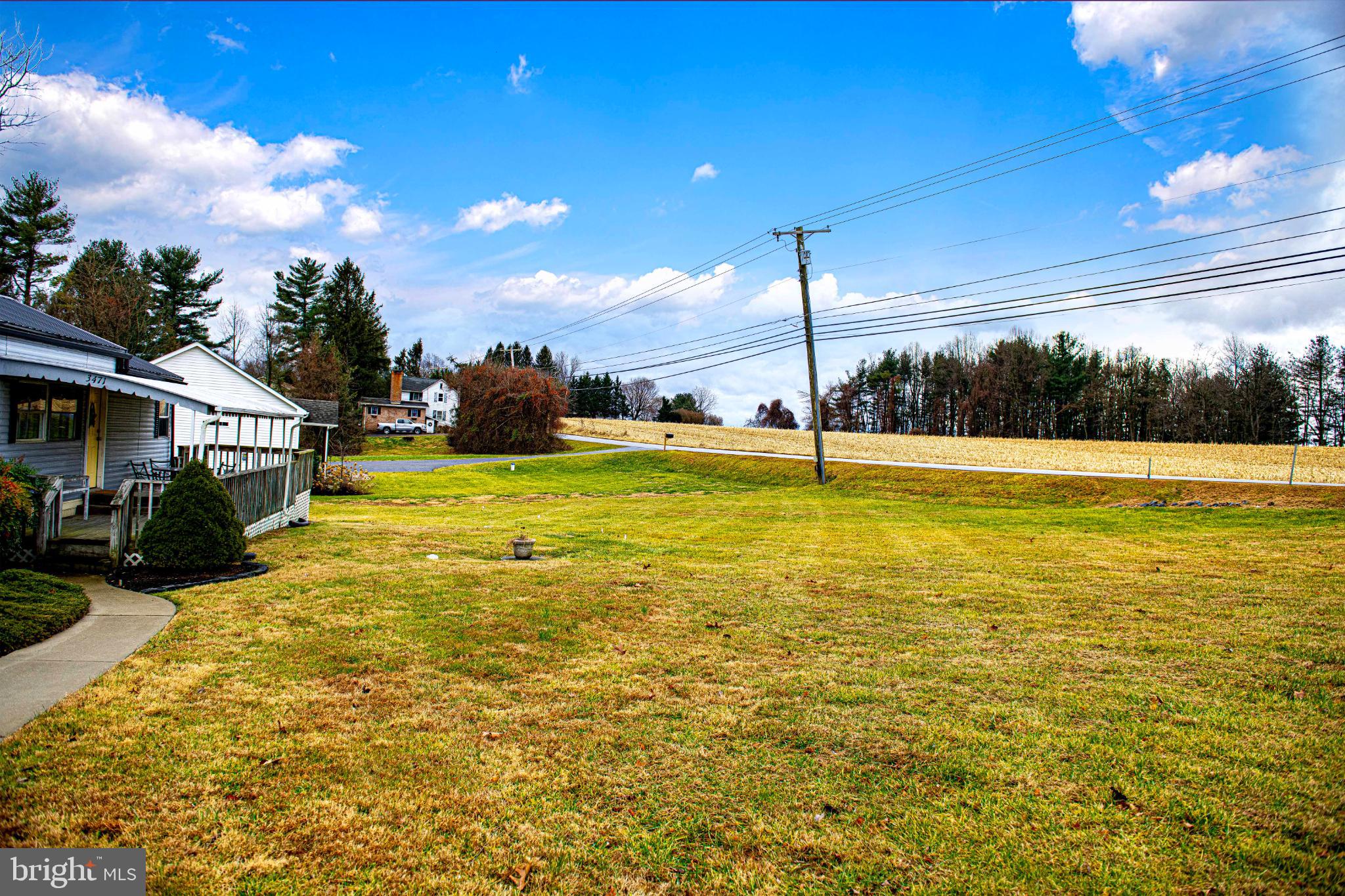 3471 Fallston Road Fallston, MD 21047 - Photo 25 of 33 Spacious lawn under a bright blue sky.