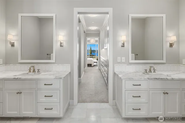 a bathroom with a granite countertop sink mirror and vanity