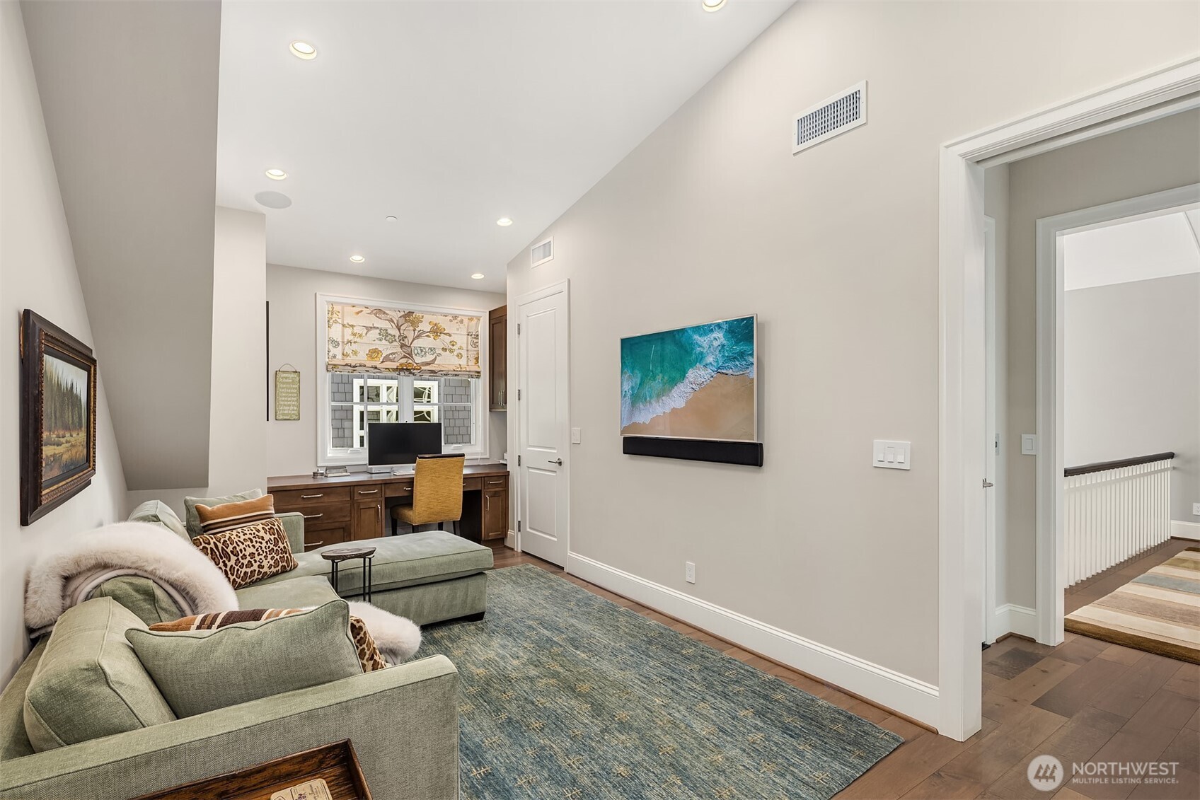 2409 Evergreen Point Road Medina, WA 98039 - Photo 16 of 40 a living room with furniture and a flat screen tv