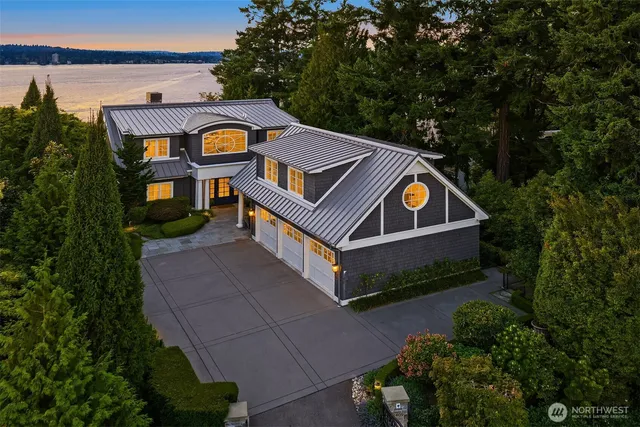 an aerial view of a house with a yard and potted plants