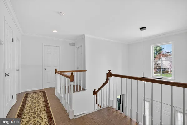 a view of a hallway with windows