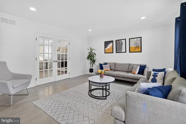 a living room with furniture and a table