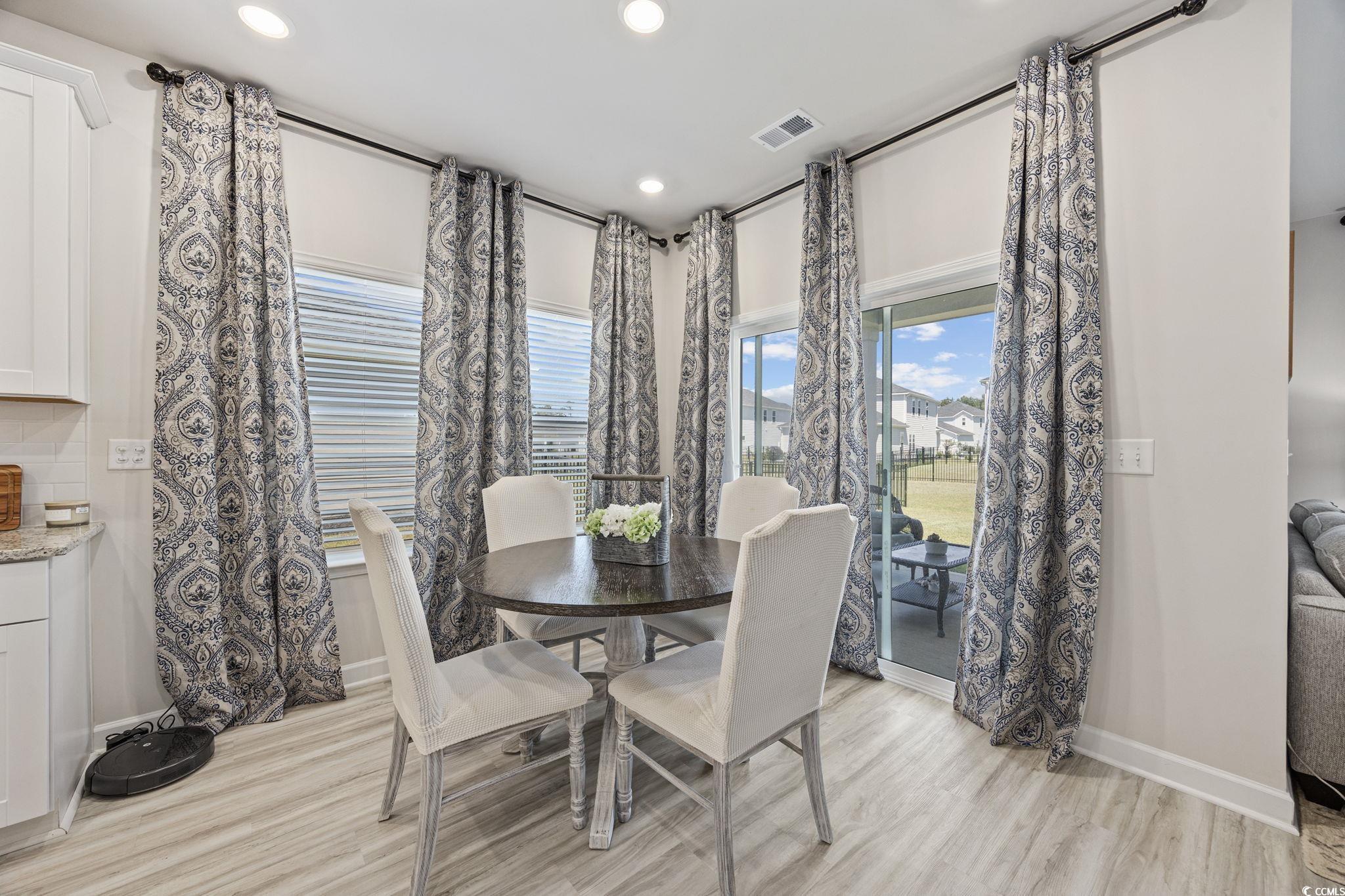 2412 Copper Mdw Loop Longs, SC 29568 - Photo 11 of 40 Dining space with light wood-style floors and recessed lighting