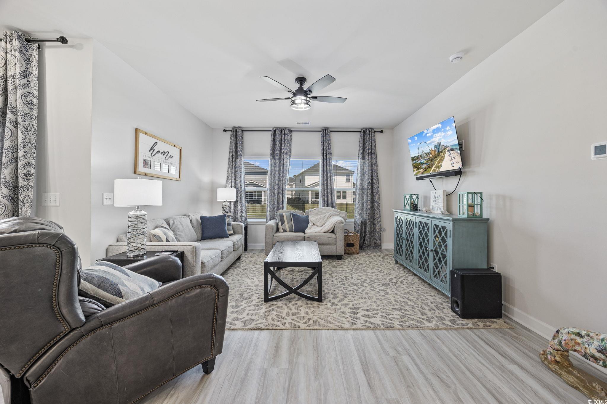 2412 Copper Mdw Loop Longs, SC 29568 - Photo 13 of 40 Living area featuring light wood-type flooring and ceiling fan