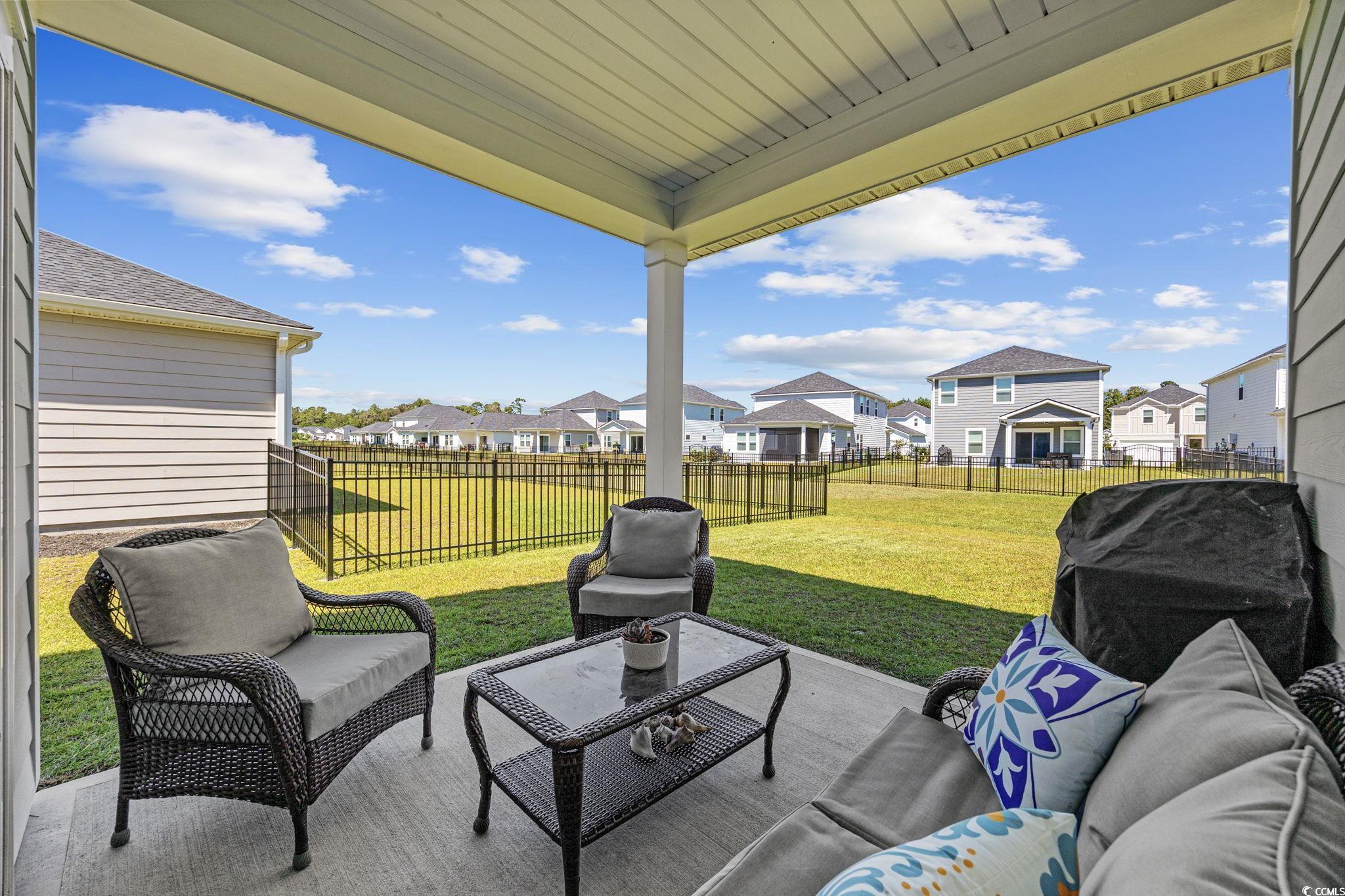 2412 Copper Mdw Loop Longs, SC 29568 - Photo 29 of 40 Fenced backyard featuring a patio, an outdoor living space, a residential view, and grilling area