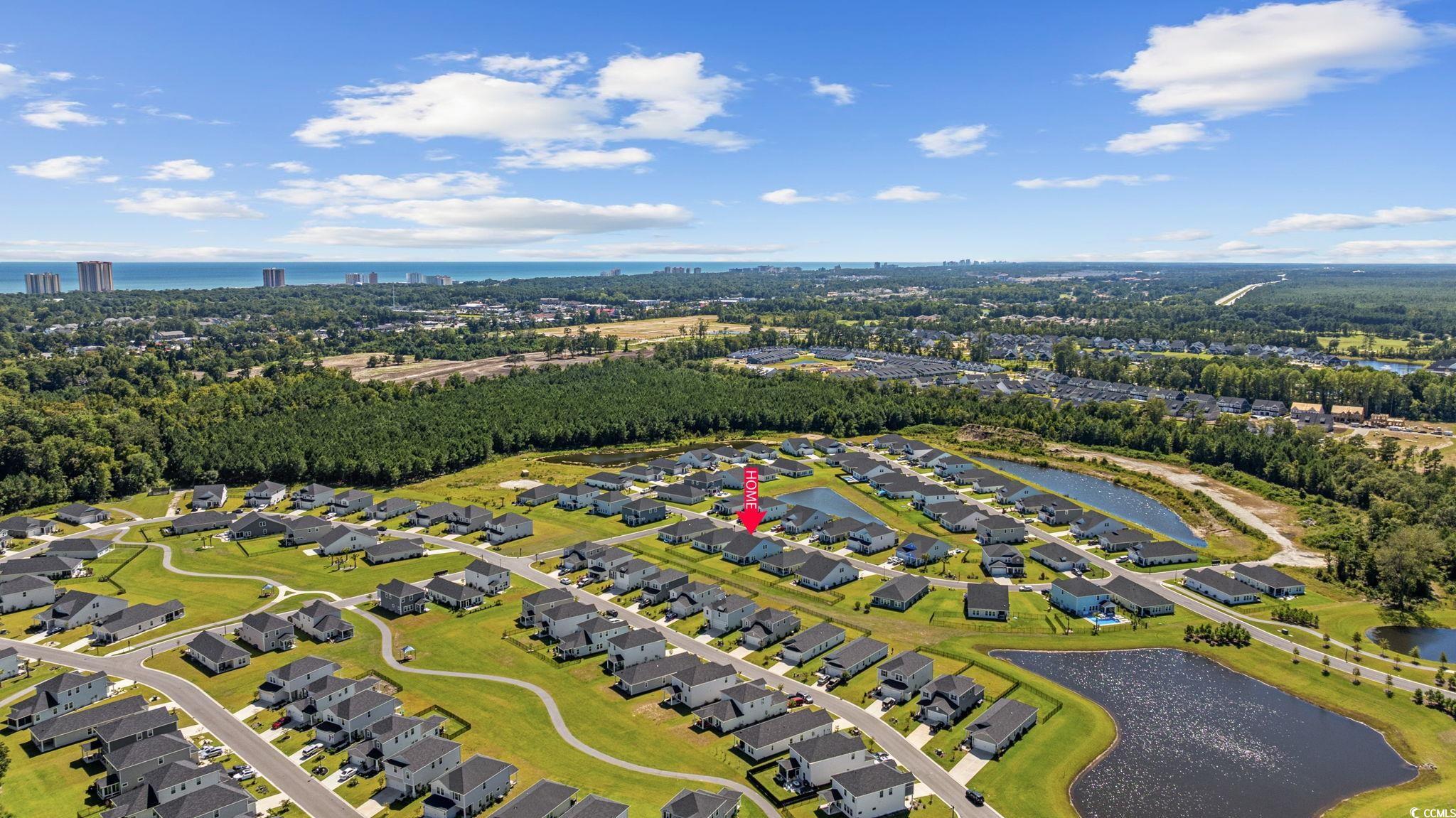 2412 Copper Mdw Loop Longs, SC 29568 - Photo 32 of 40 Aerial view of residential area with a large body of water