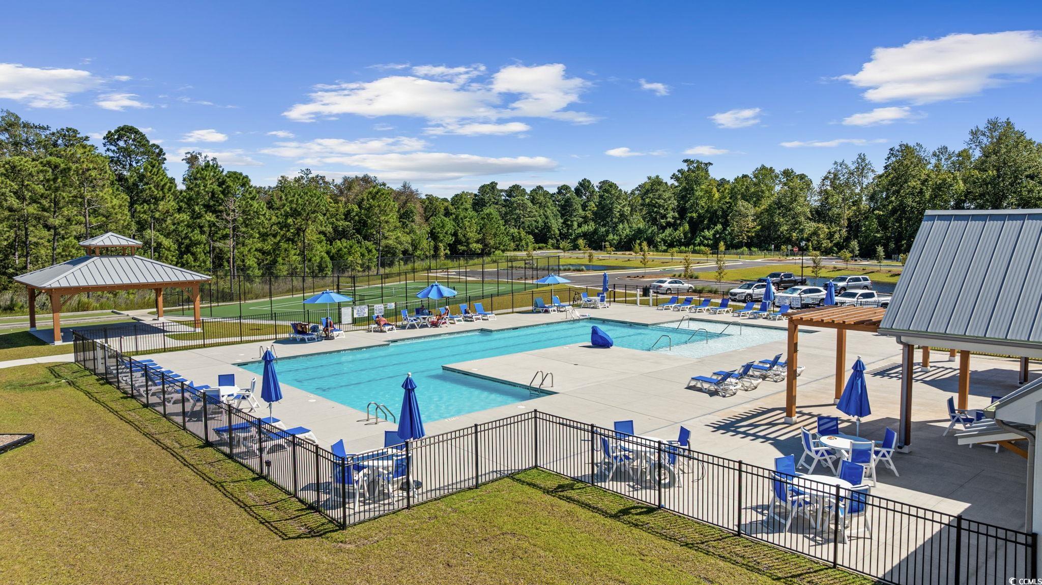 2412 Copper Mdw Loop Longs, SC 29568 - Photo 35 of 40 Community pool featuring a patio, view of wooded area, and a gazebo