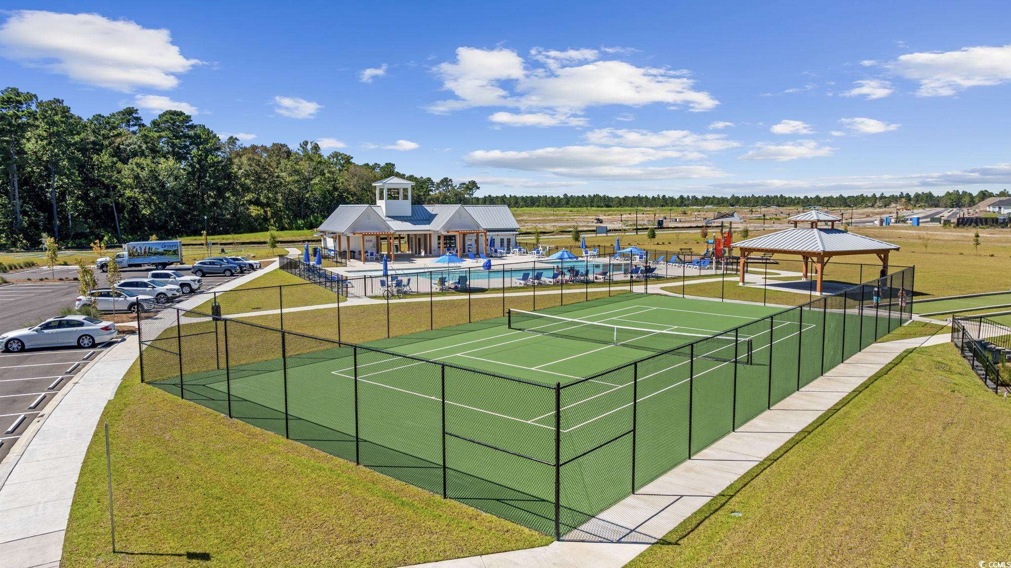 2412 Copper Mdw Loop Longs, SC 29568 - Photo 38 of 40 View of tennis court with a gazebo and a community pool