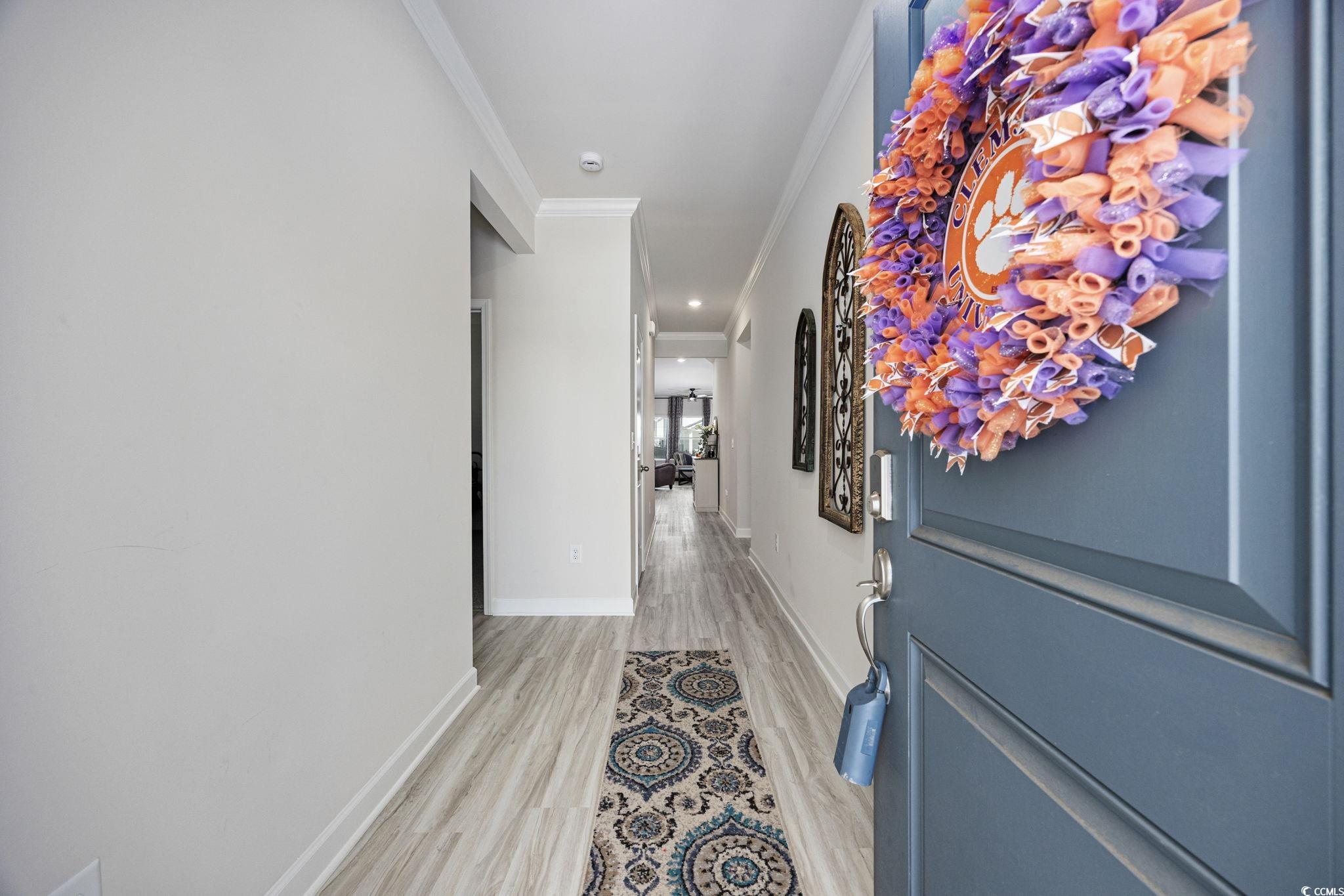 2412 Copper Mdw Loop Longs, SC 29568 - Photo 4 of 40 Corridor featuring ornamental molding and light wood-type flooring