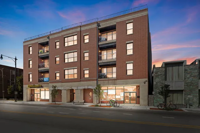 a front view of a building with a street