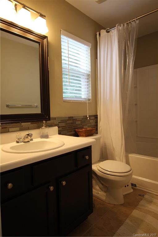 1022 Mearn Road Charlotte, NC 28216 - Photo 11 of 15 a bathroom with a double vanity sink toilet and a mirror
