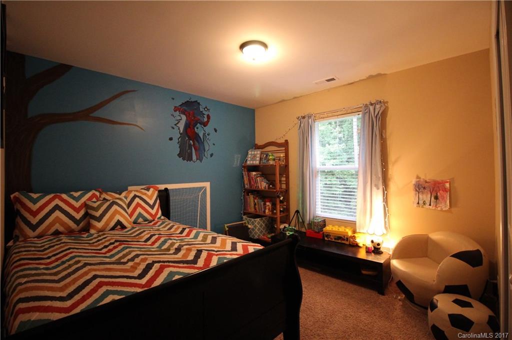 1022 Mearn Road Charlotte, NC 28216 - Photo 13 of 15 a bedroom with a bed and a window