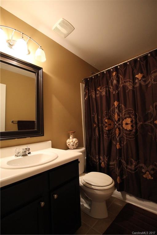 1022 Mearn Road Charlotte, NC 28216 - Photo 14 of 15 a bathroom with a sink vanity mirror and toilet