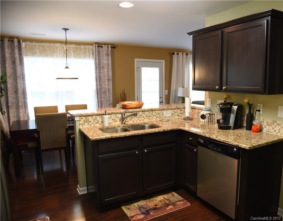 1022 Mearn Road Charlotte, NC 28216 - Photo 5 of 15 a kitchen with a sink stove and cabinets
