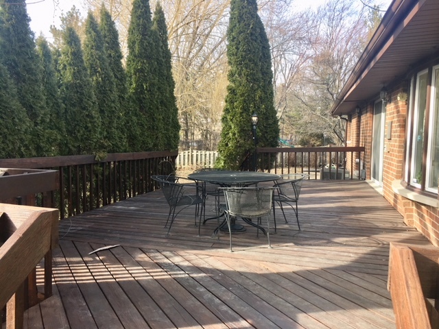 2160 Clover Road Northbrook, IL 60062 - Photo 14 of 16 a view of a patio with table and chairs and wooden floor