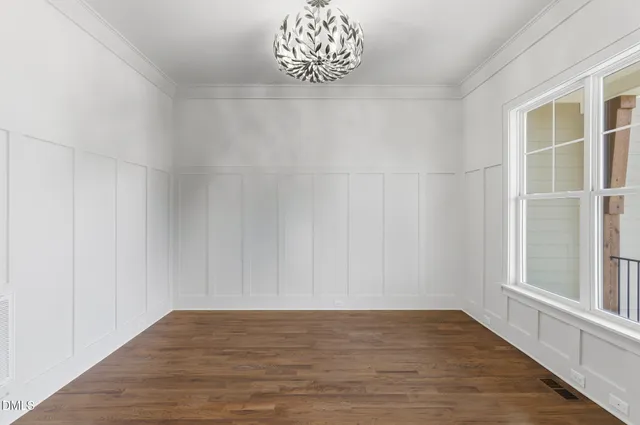 a bathroom with a granite countertop sink mirror and toilet