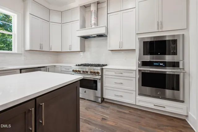 a spacious bathroom with a double vanity sink and a mirror