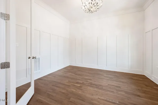 a view of an entryway with wooden floor