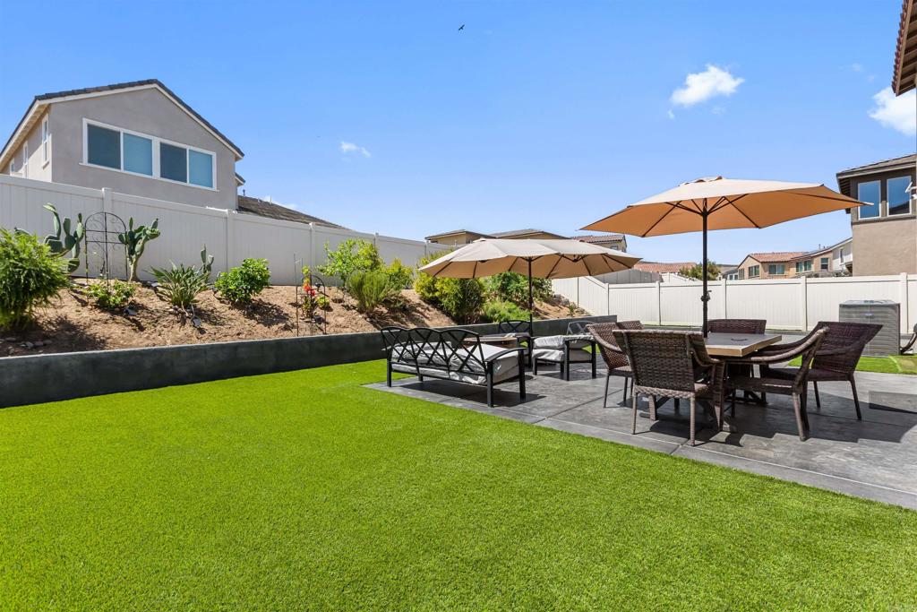 29809 Gypsy Vanner Way Menifee, CA 92584 - Photo 36 of 45 a view of a yard with furniture and a garden