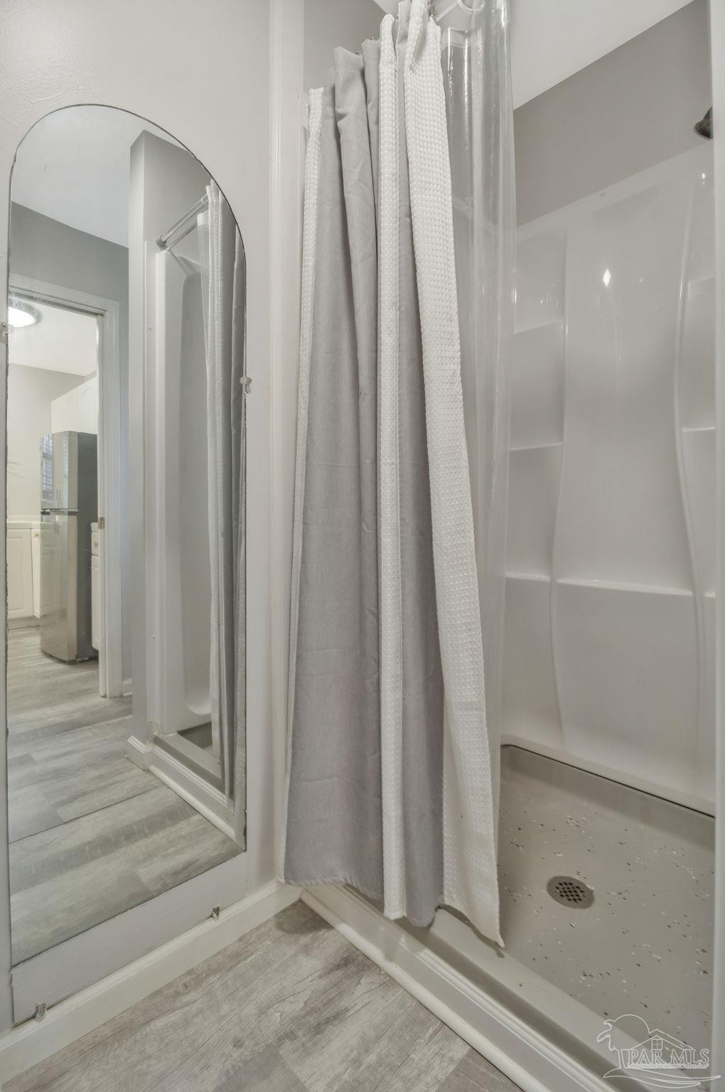 10290 West Lake Road Milton, FL 32583 - Photo 17 of 53 a view of a bathroom with shower