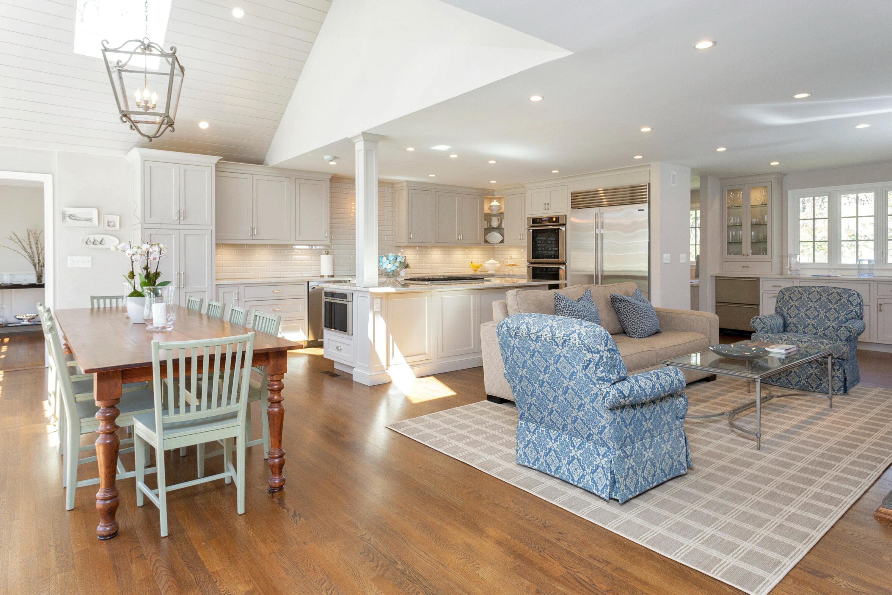16 Half Mile Road Darien, CT 06820 - Photo 12 of 59 a living room with furniture wooden floor and a chandelier