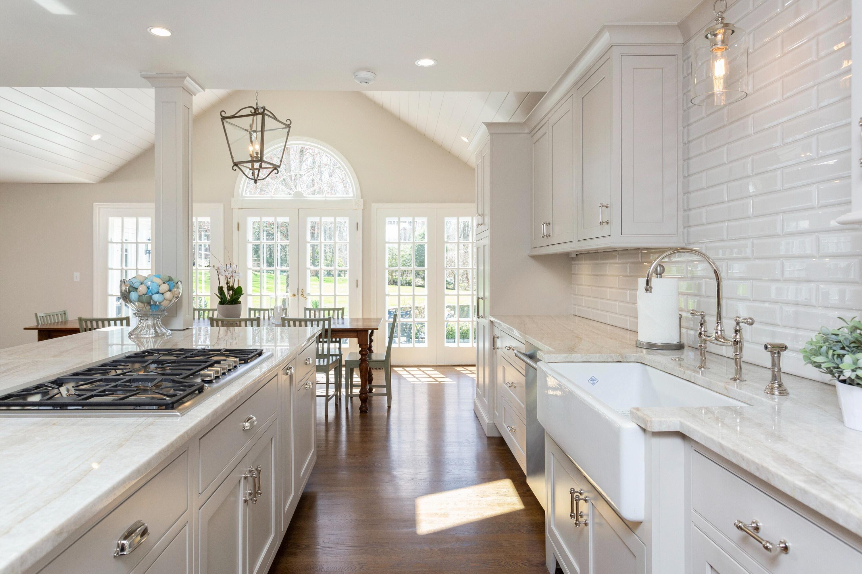 16 Half Mile Road Darien, CT 06820 - Photo 14 of 59 a kitchen with lots of counter top space a sink appliances and cabinets