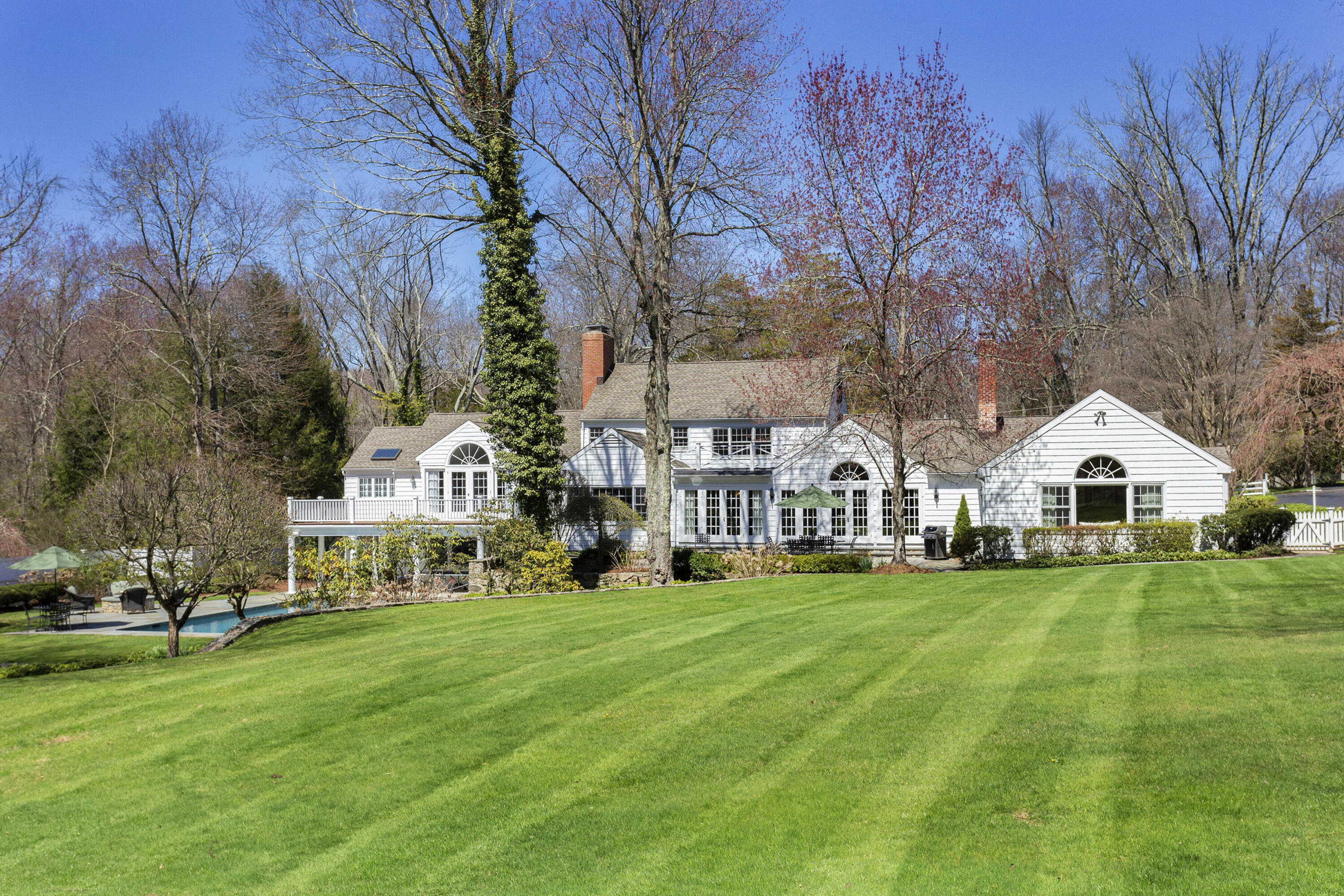 16 Half Mile Road Darien, CT 06820 - Photo 2 of 59 a view of a big house with a big yard and large trees