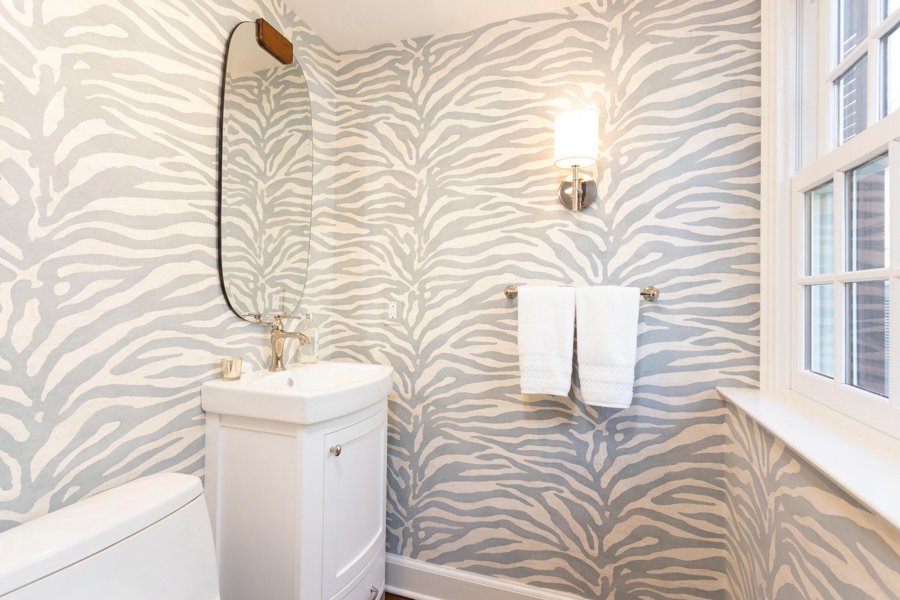 16 Half Mile Road Darien, CT 06820 - Photo 23 of 59 a bathroom with a sink and mirror with bathtub