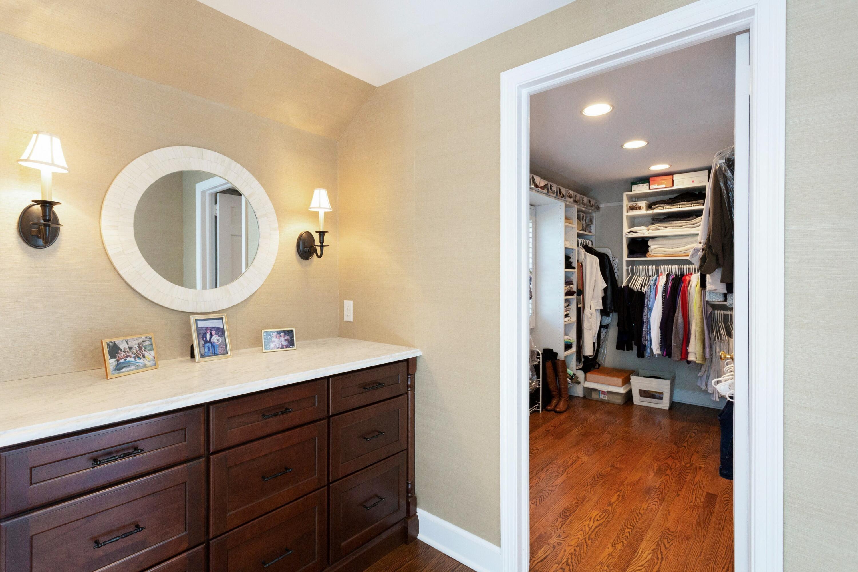 16 Half Mile Road Darien, CT 06820 - Photo 28 of 59 a view of a bathroom with a double vanity sink and a mirror