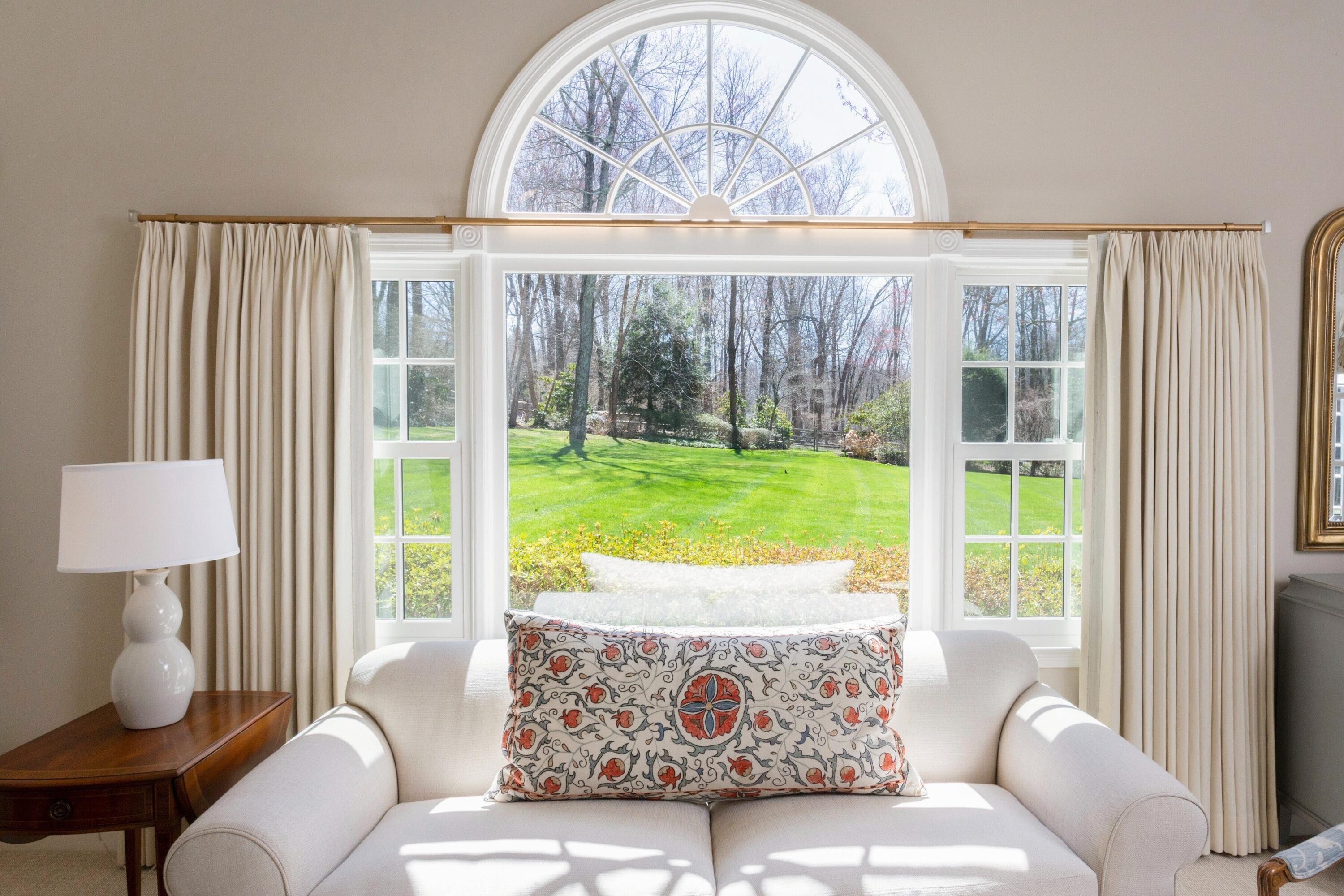 16 Half Mile Road Darien, CT 06820 - Photo 33 of 59 a living room with furniture and a large window