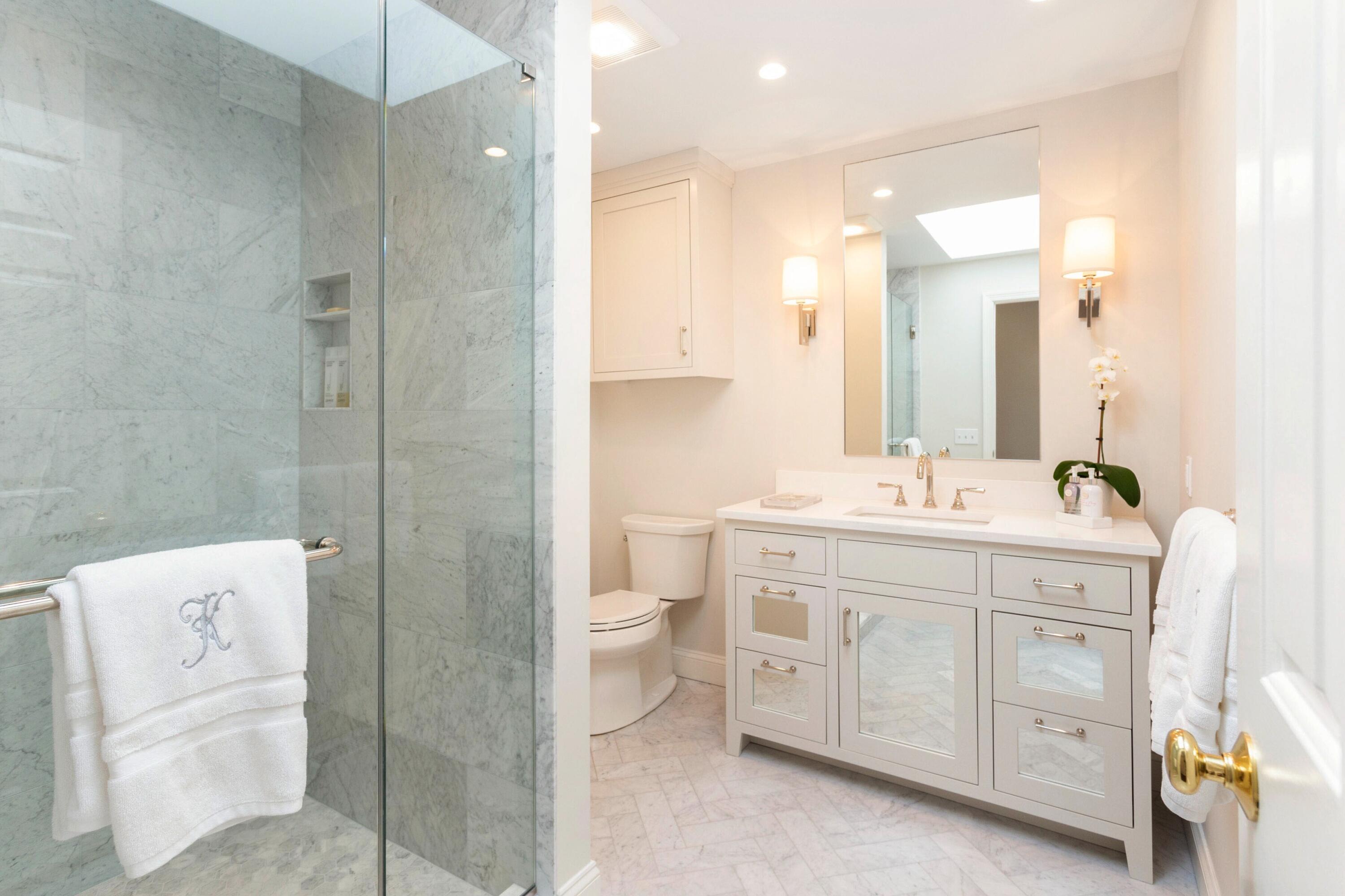 16 Half Mile Road Darien, CT 06820 - Photo 34 of 59 a bathroom with a double vanity sink a toilet and shower