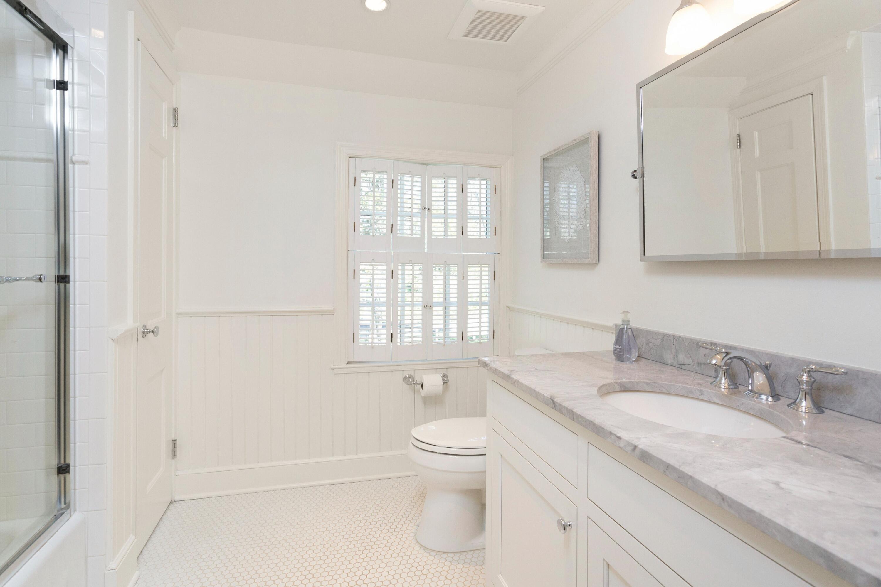 16 Half Mile Road Darien, CT 06820 - Photo 37 of 59 a bathroom with a granite countertop sink toilet and shower