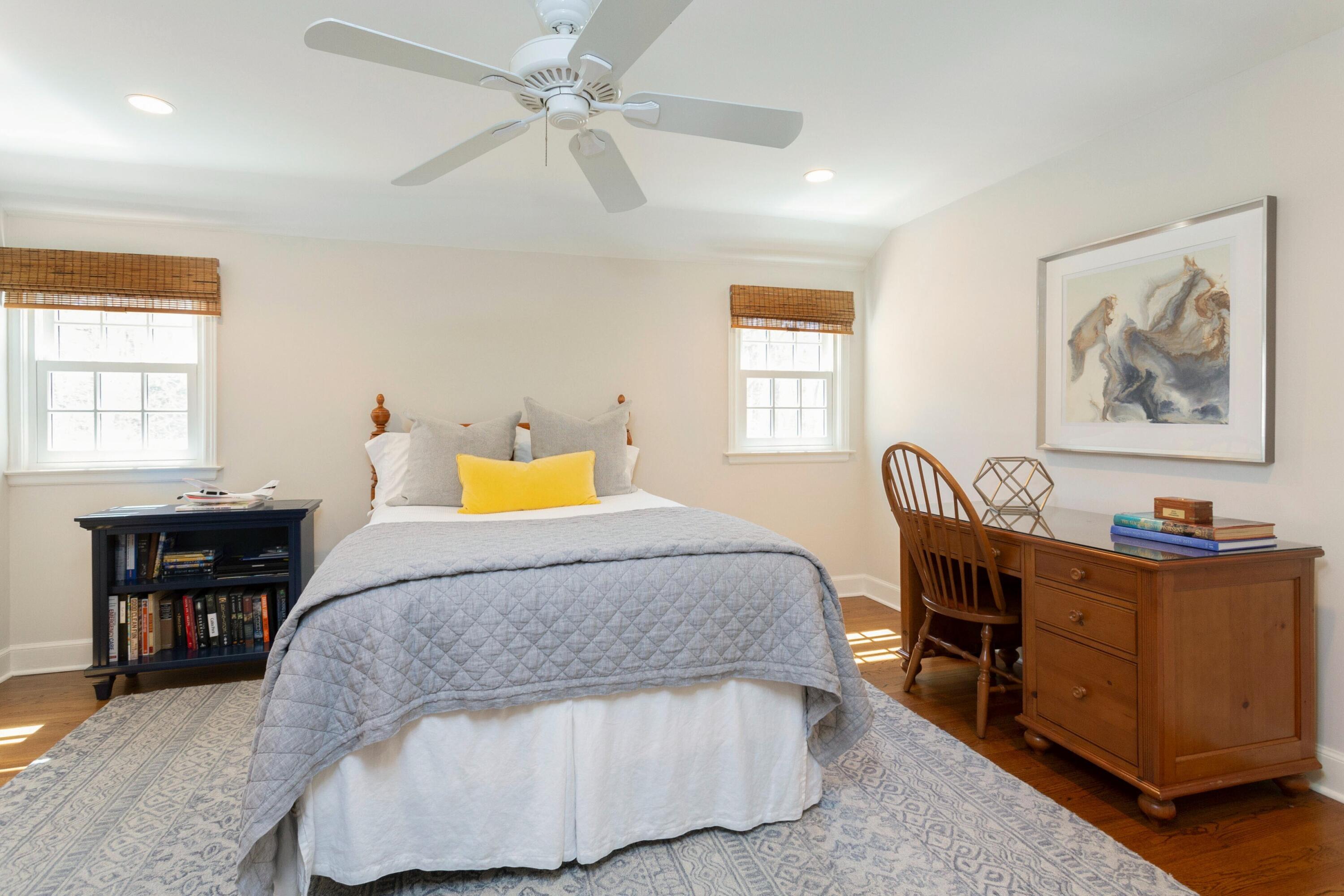 16 Half Mile Road Darien, CT 06820 - Photo 39 of 59 a bedroom with a bed and wooden furniture