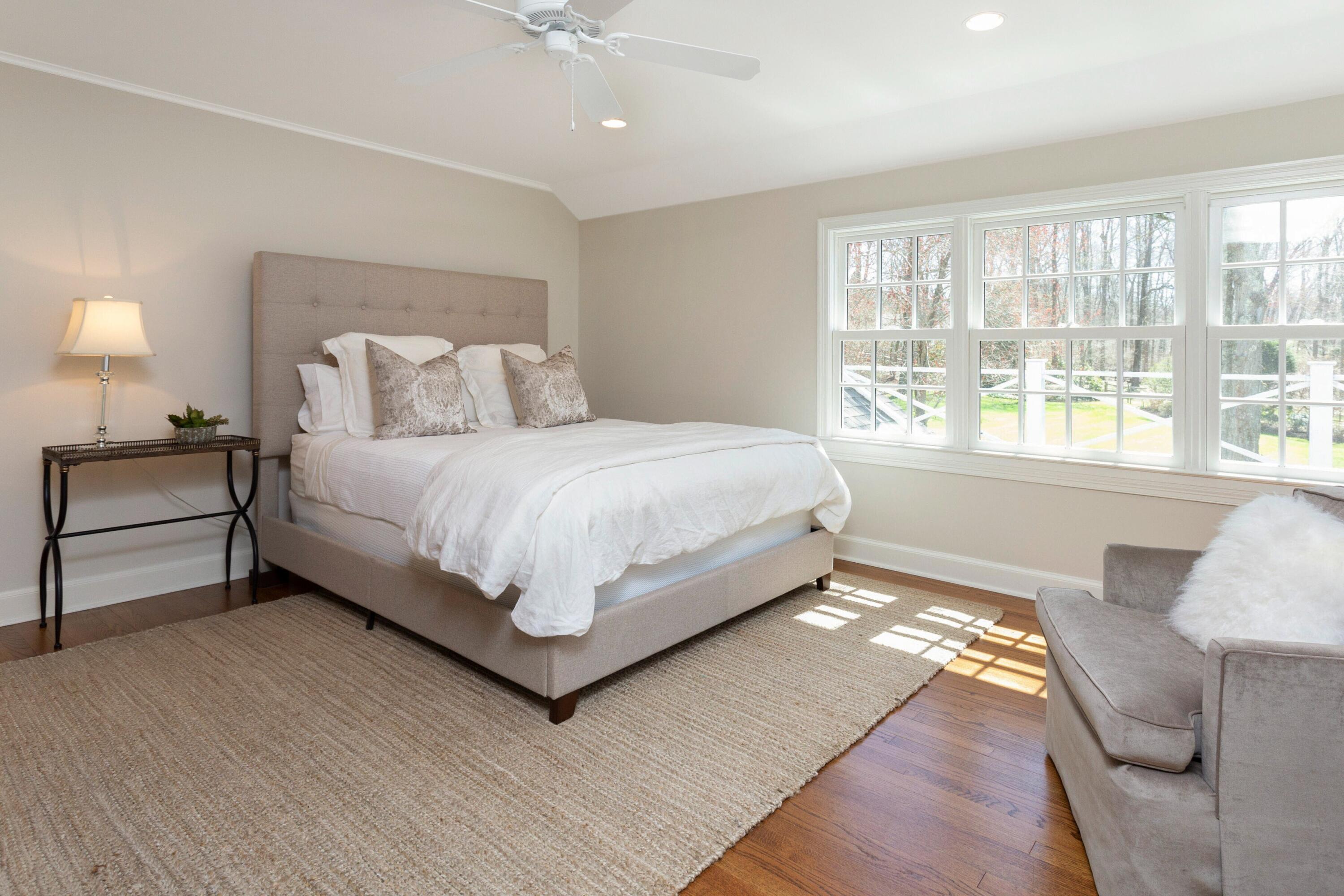 16 Half Mile Road Darien, CT 06820 - Photo 40 of 59 a bedroom with a bed and a large window