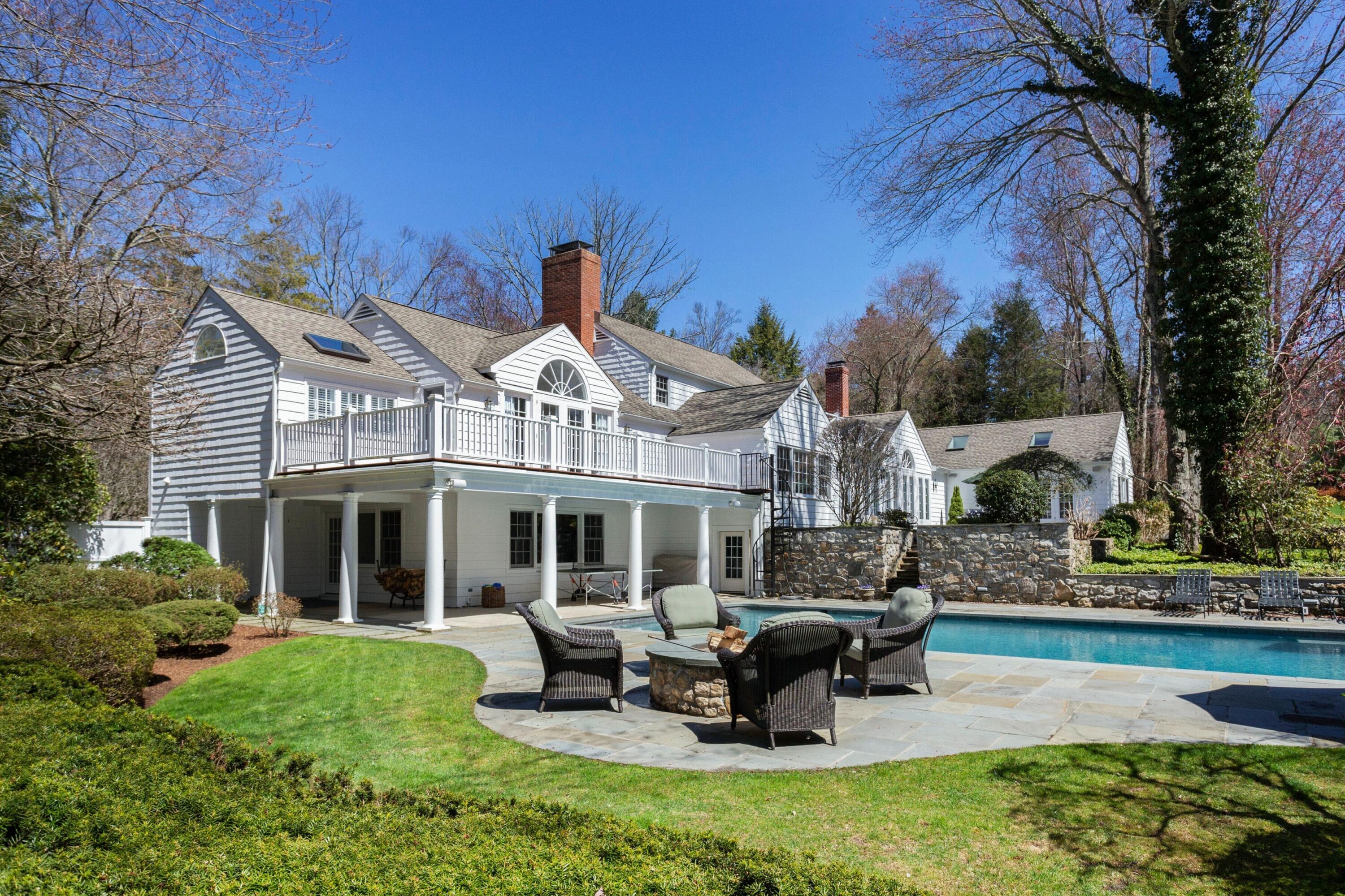 16 Half Mile Road Darien, CT 06820 - Photo 46 of 59 a front view of a house with swimming pool and sitting area