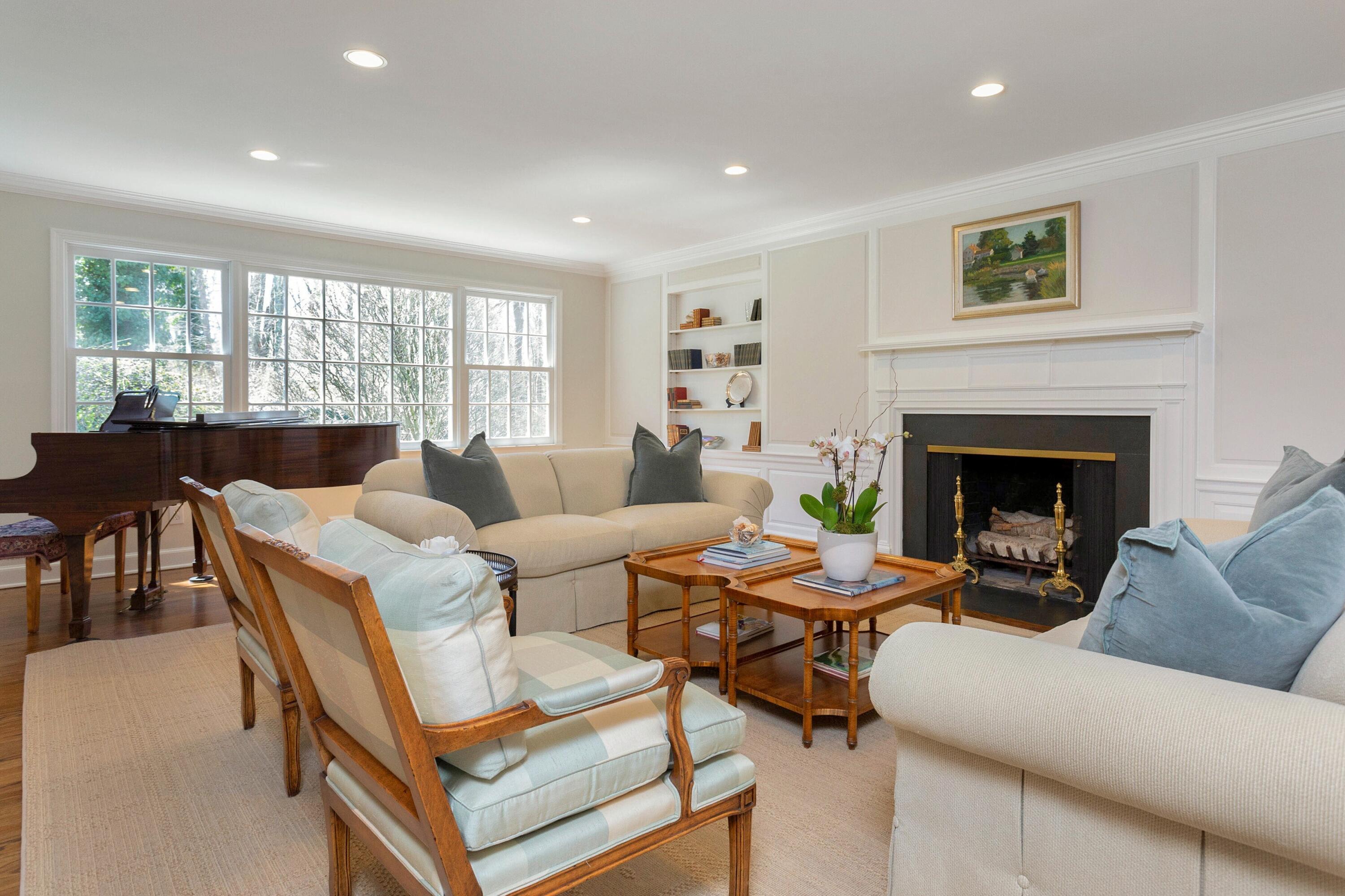 16 Half Mile Road Darien, CT 06820 - Photo 6 of 59 a living room with furniture a fireplace and a large window