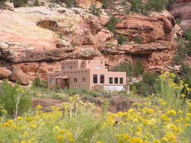 12665 G Road Cortez, CO 81321 - Photo 1 of 9 a front view of a house with a yard